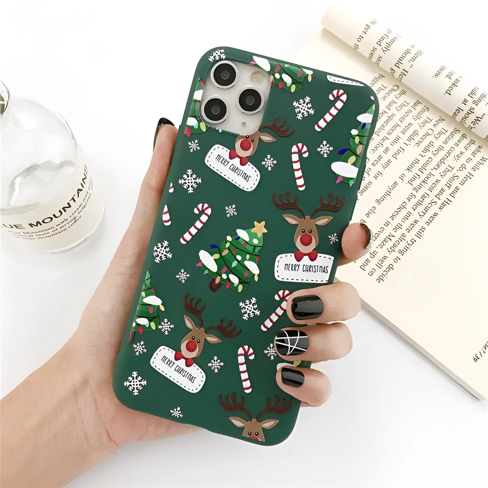 Green TPU iPhone case with cartoon Christmas tree and elk design for multiple models.