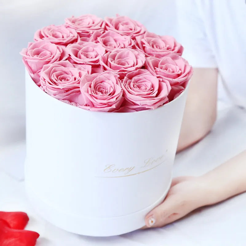 Handmade everlasting rose in hug bucket with preserved flower material, available in white red pink black blue colours