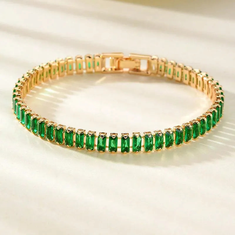Unisex gold electroplated double-row diamond zirconia tennis chain bracelet on white background