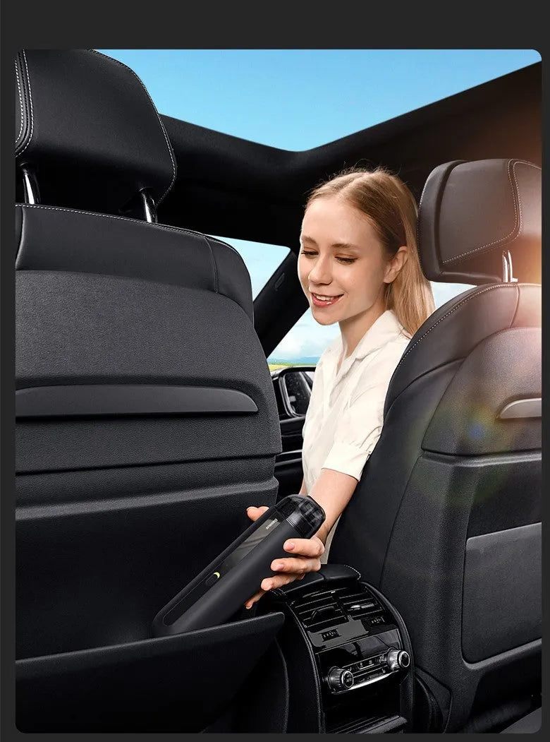 Black handheld wireless car vacuum cleaner with nozzle and blowing hose accessory