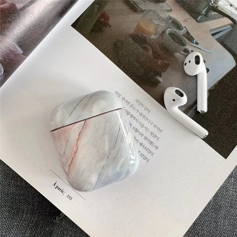 White marble protective case for Apple AirPods charging box showing hard PC construction