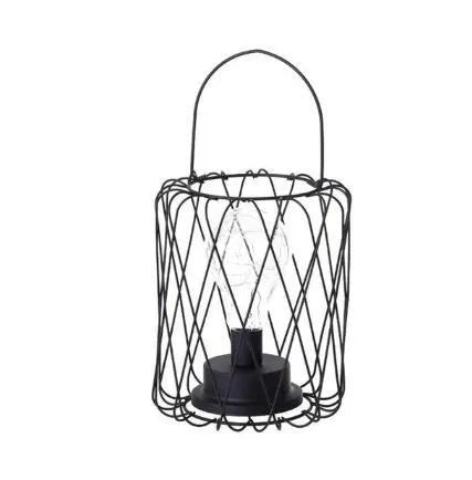 Minimalist hollow iron table lamp in red wine glass style on a wooden desk.