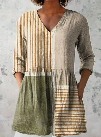 Women's long loose dress with a blue and white wave print pattern, featuring three-quarter sleeves and a wide waist.
