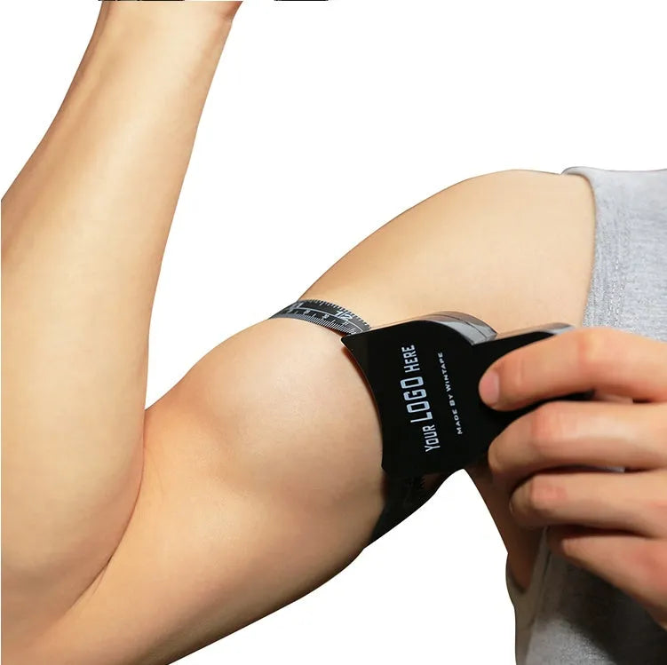 Black ABS plastic body fat caliper with measurement gauge and detachable cable for skin fold thickness testing.