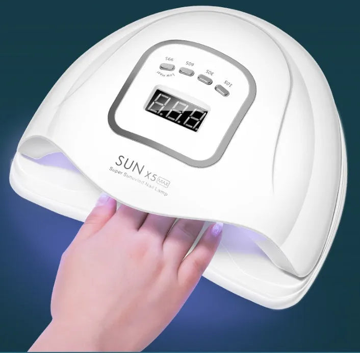 White nail drying lamp with UV and LED lights showing digital timer display