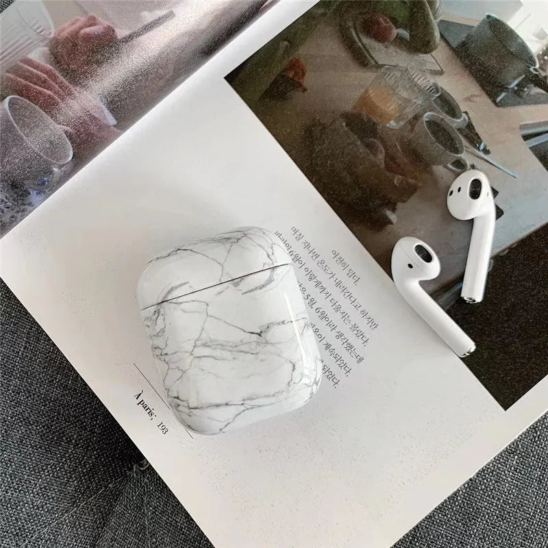 White marble protective case for Apple AirPods charging box showing hard PC construction