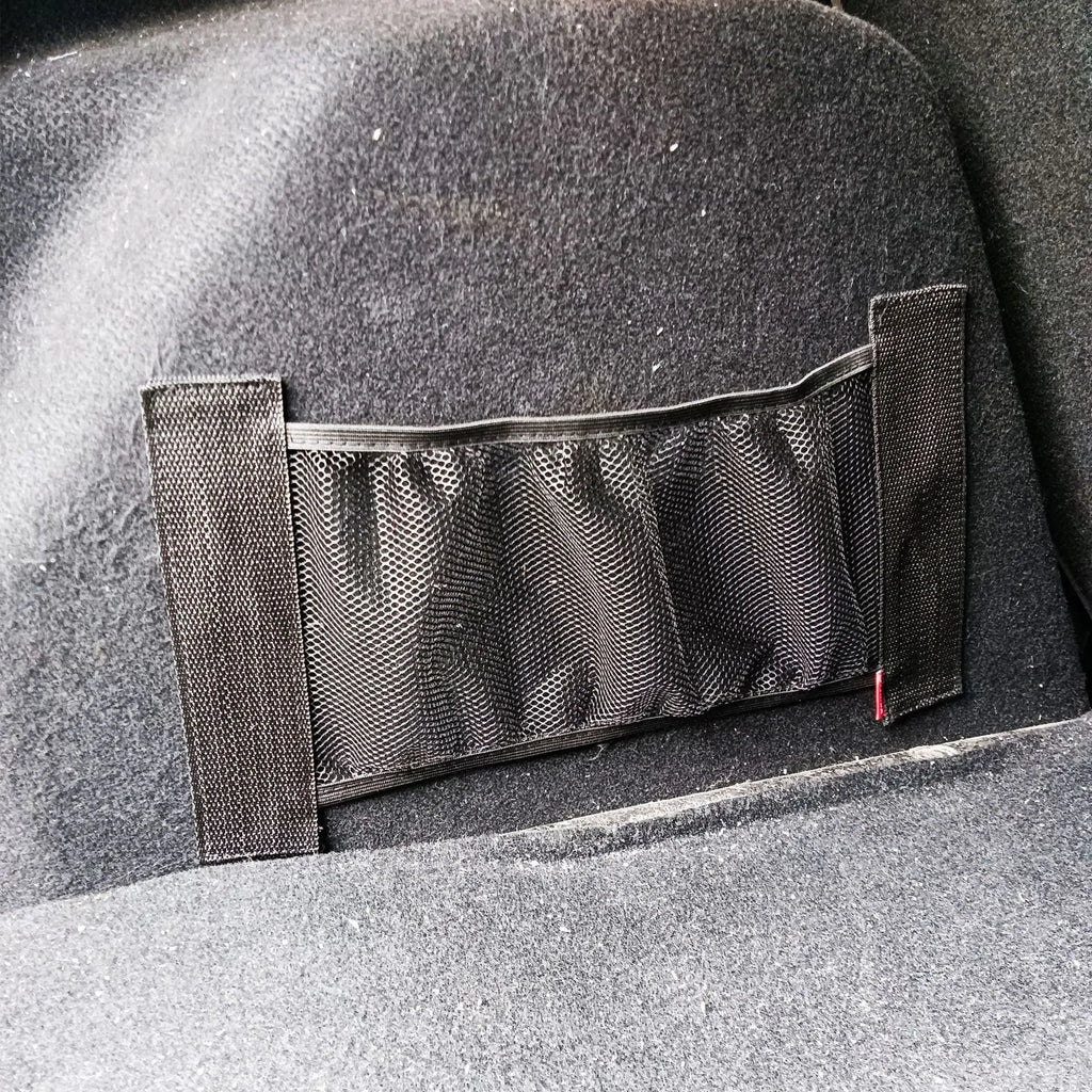 Car trunk elastic storage net organising loose items in vehicle boot