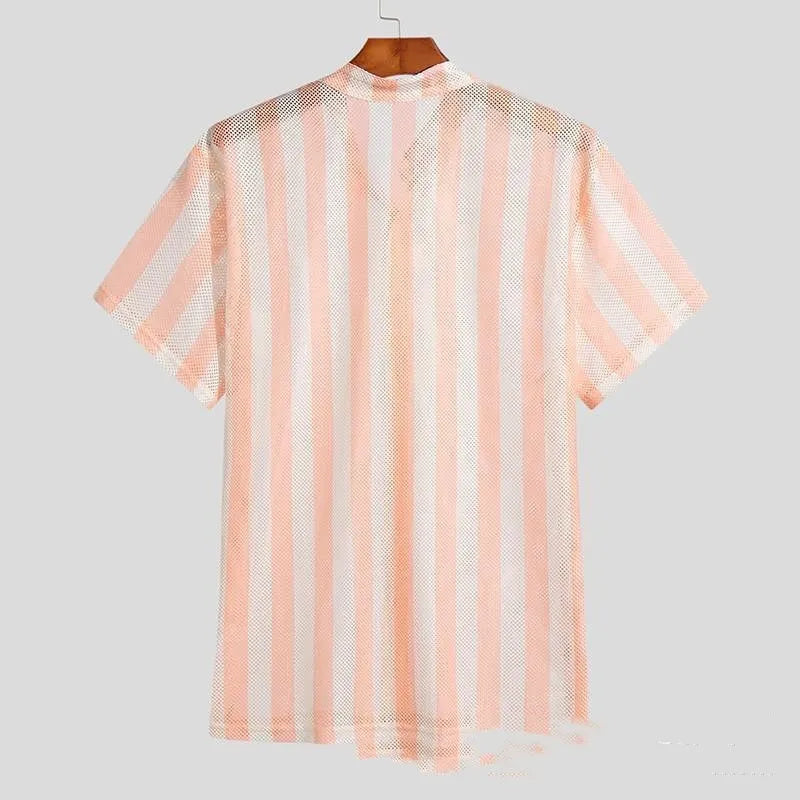 Men's pink loose-fit cardigan with a waffle texture and unique hole design detail.