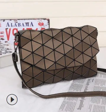 Rhombic ABS shoulder bag in envelope style, available in multiple colours including black and pink.