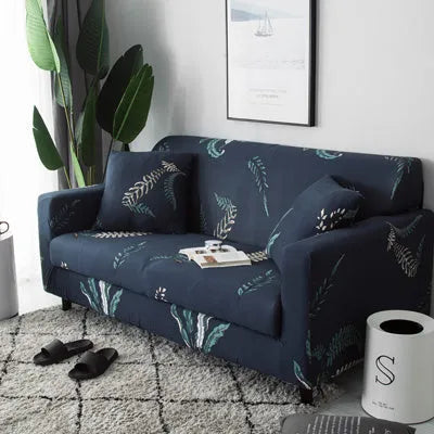 Geometric patterned stretch sofa slipcover fitted on a modern two-seater sofa.