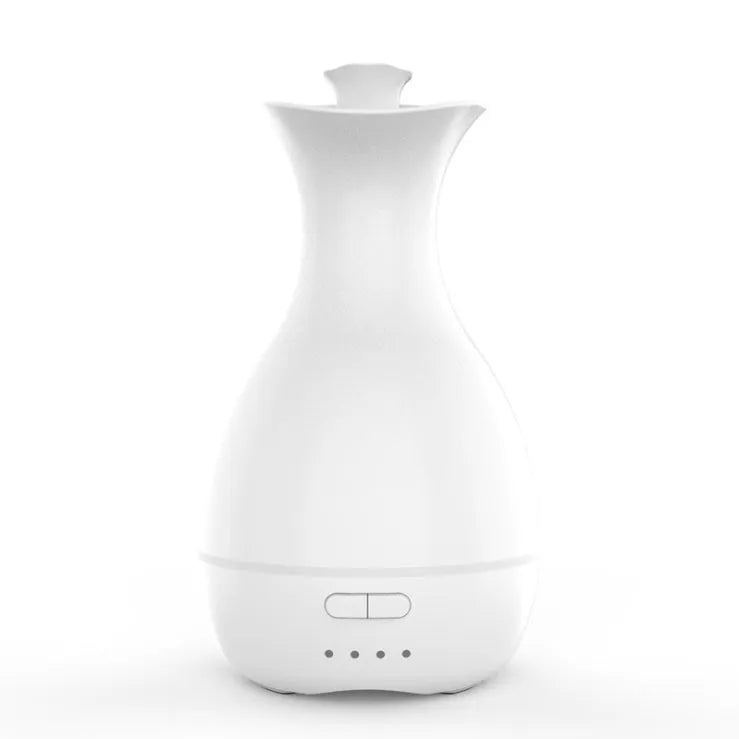 White ultrasonic aromatherapy diffuser with 200ml capacity and multicolour LED lighting on wooden table