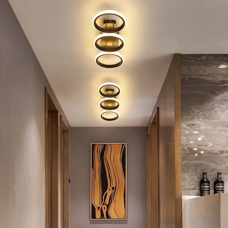 Modern simplicity hallway LED ceiling light in black with three round shapes over a corridor