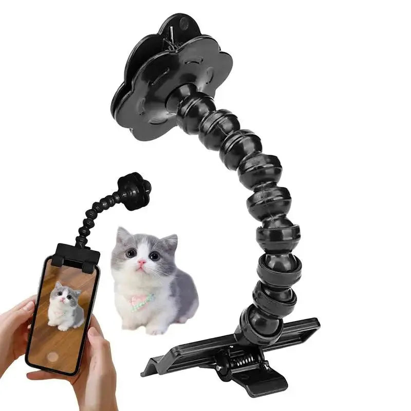 Black pet photography tool holding a mobile phone and a dog treat, on a white background.