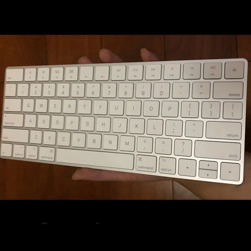 Apple white metal Bluetooth wireless keyboard with ultra-thin design and multimedia keys