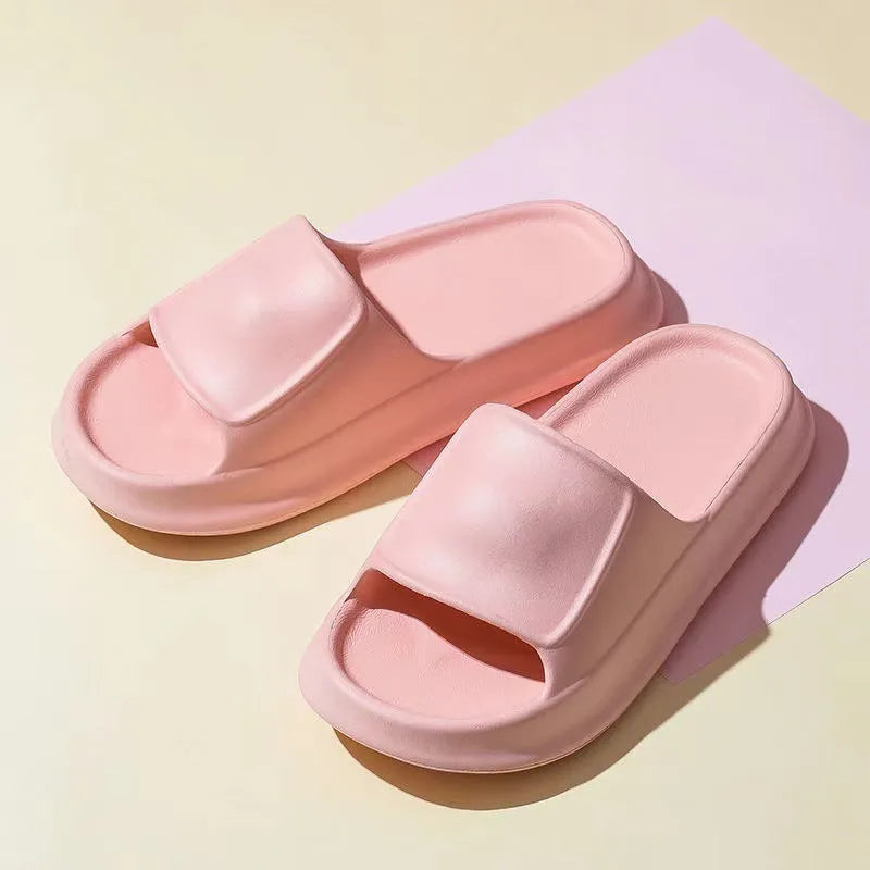 Soft EVA flip-flop slippers with thick sole in multiple colours on a white background.