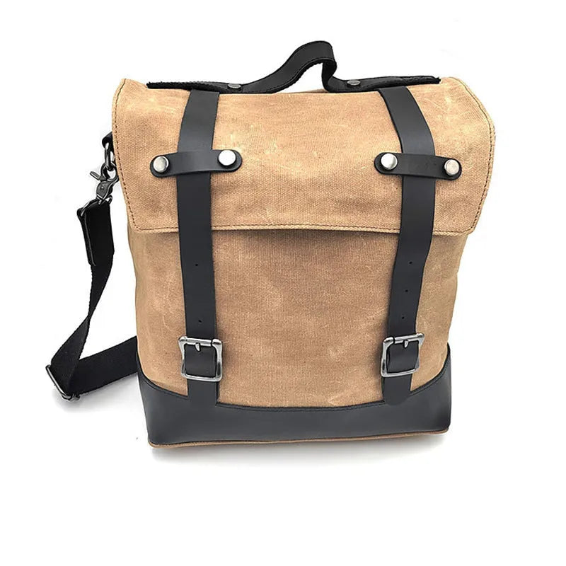 Large black waterproof canvas motorcycle side bag with cowhide top layer mounted on motorcycle