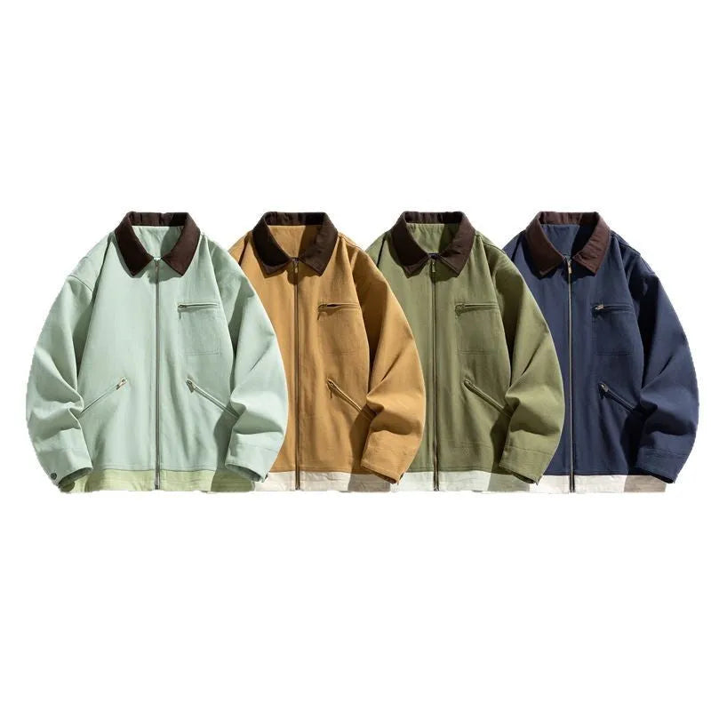 Man wearing a mint green loose-fit retro workwear jacket with dark contrast lapels and side seam pockets.