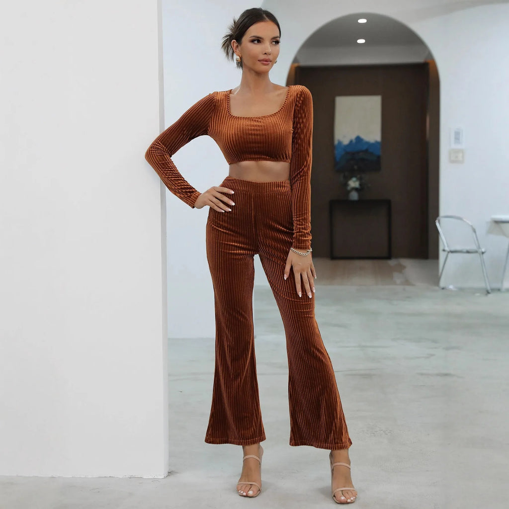 Caramel coloured long sleeve sweater and matching trousers lounge set on a hanger