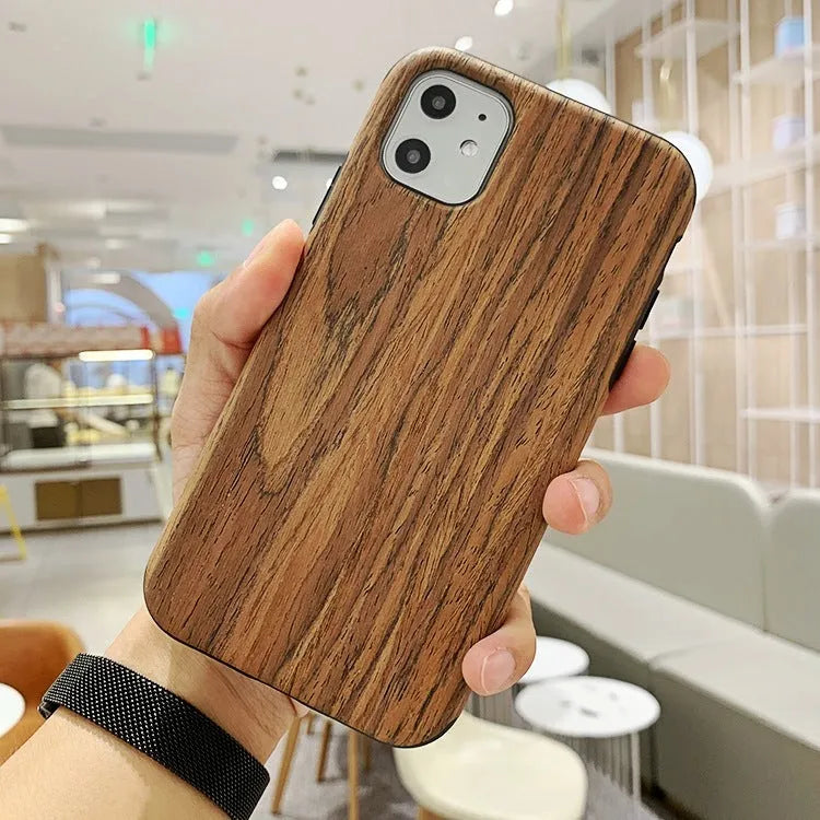 Wooden iPhone case with natural wood grain showing rosewood finish on iPhone 11 Pro
