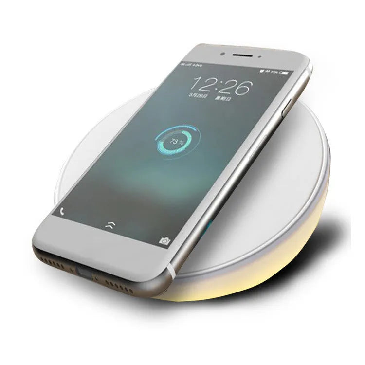 White 10W wireless charging pad with digital clock display and three control buttons.