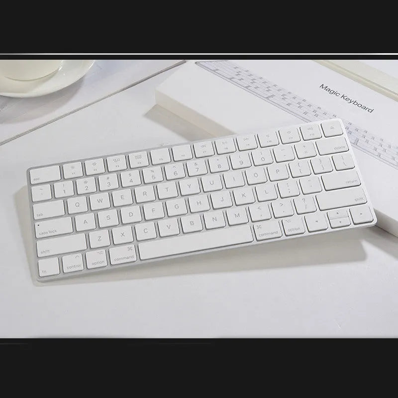 Apple white metal Bluetooth wireless keyboard with ultra-thin design and multimedia keys