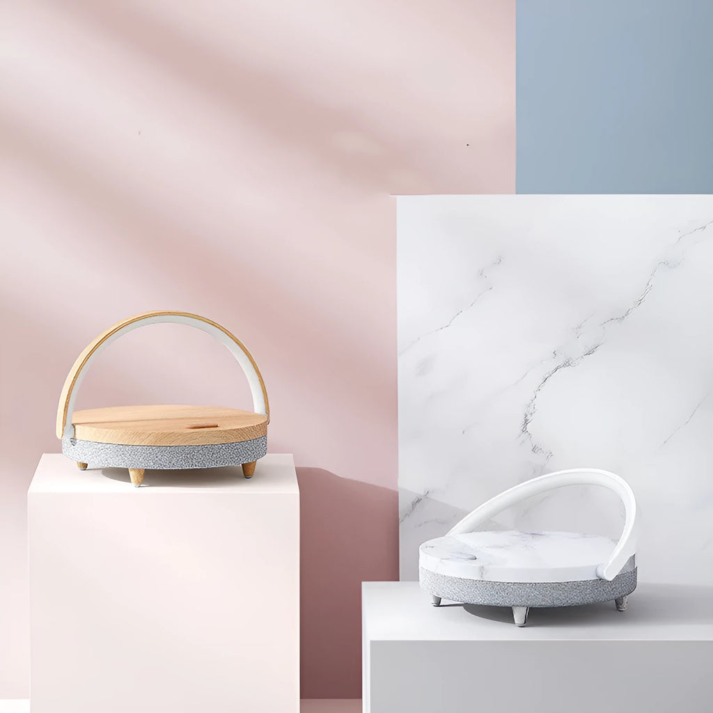 Wireless charging LED night light with Bluetooth speaker and phone holder in compact bedside design