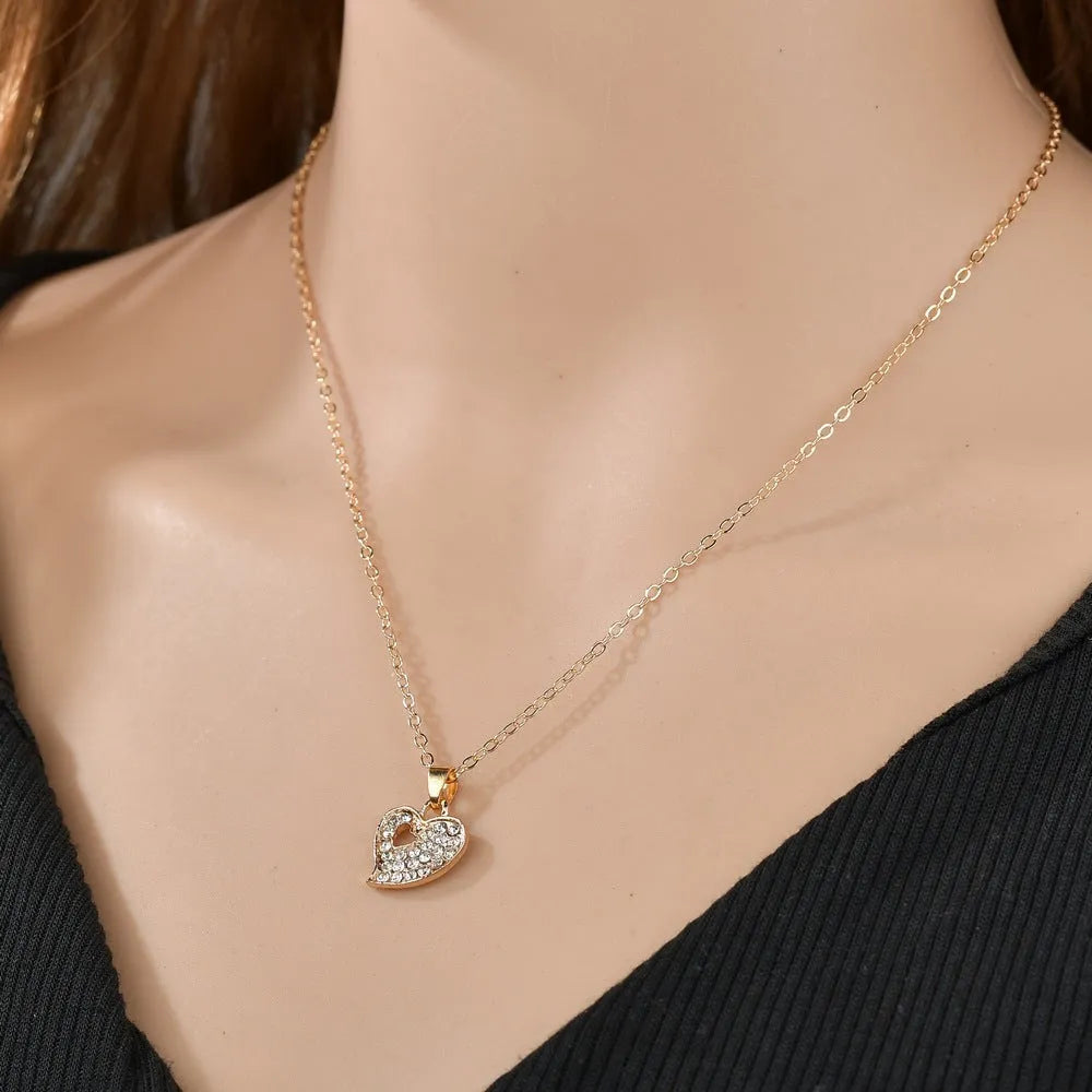 Gold electroplated alloy women's jewellery set with love pendant necklace, earrings and bracelet