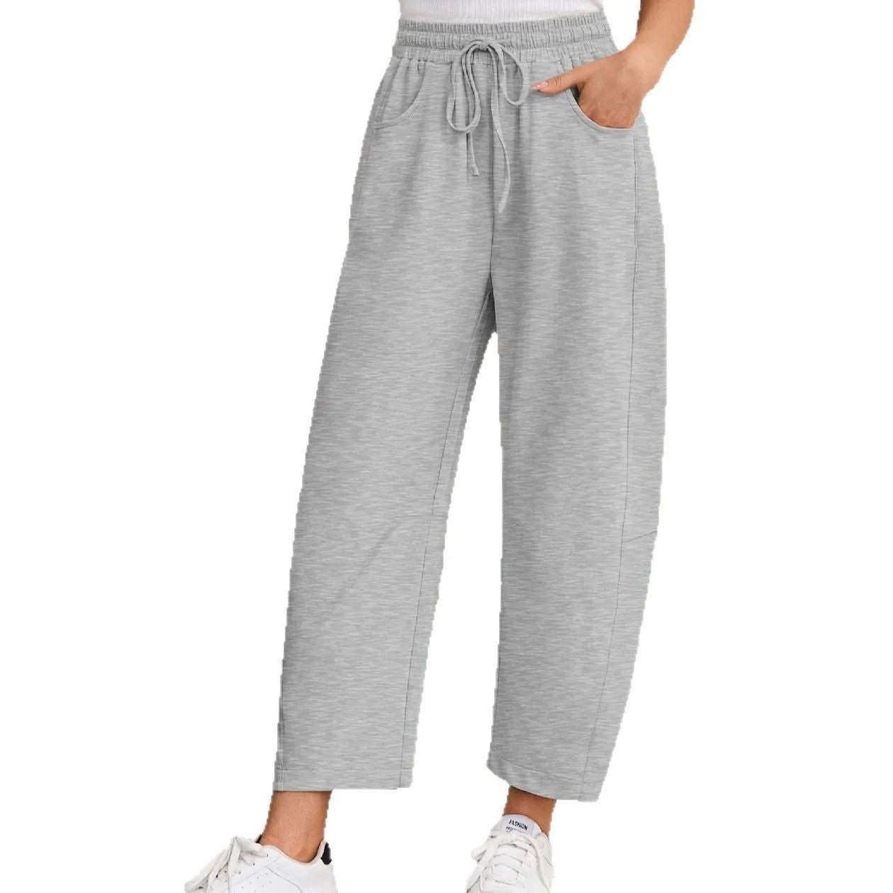 Loose grey cropped sweatpants with elastic drawstring waist and pockets on a mannequin