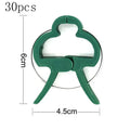 Green plastic plant fixing clips for supporting climbing vegetables like tomatoes and cucumbers