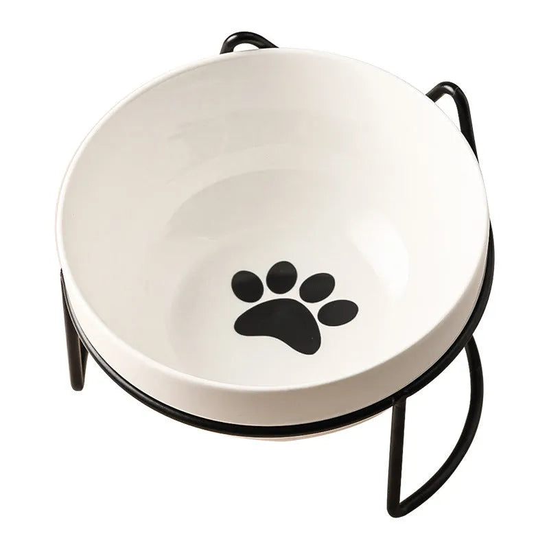 White ceramic cat bowl with decorative patterns on iron frame with cat ear details