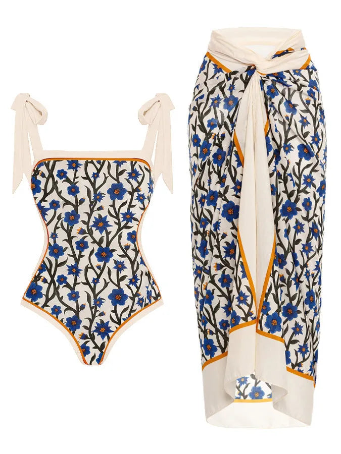 Women's two-piece floral printed polyester swimsuit with matching hip skirt in conservative style