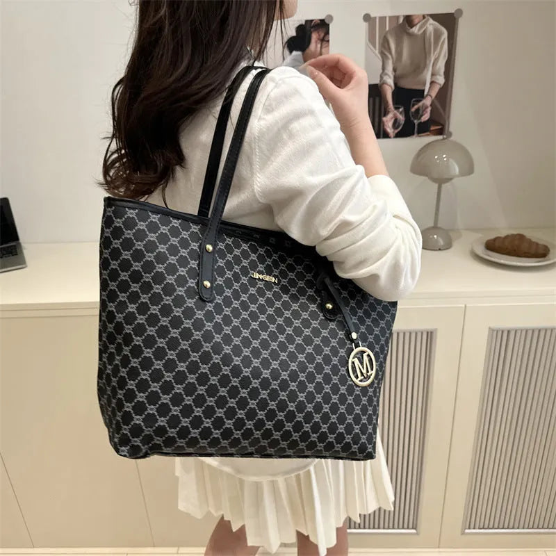 Street trend western style shoulder bag in PU material with sewn detailing, shown in black.