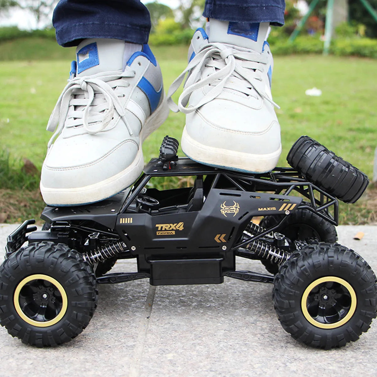 Large black 4WD remote control off-road climbing car with 2.4G wireless controller
