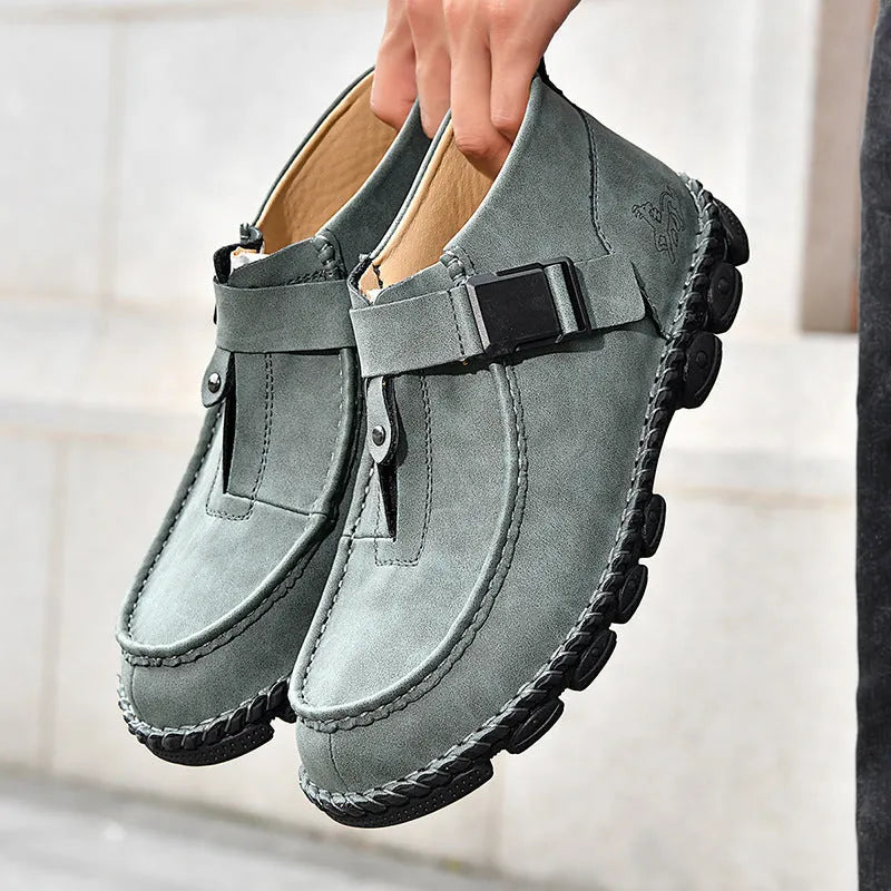 Men's black handmade stitching slip-on casual flat shoes with a low heel.