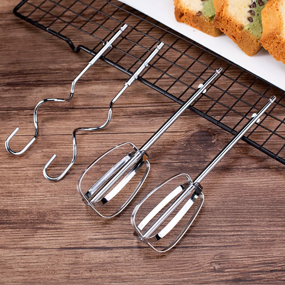 White 500W 5-speed electric hand mixer with beaters and dough hooks on a kitchen counter