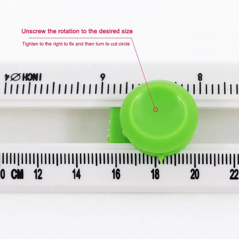 Orange plastic round paper cutter for A3 sheets on a colour box