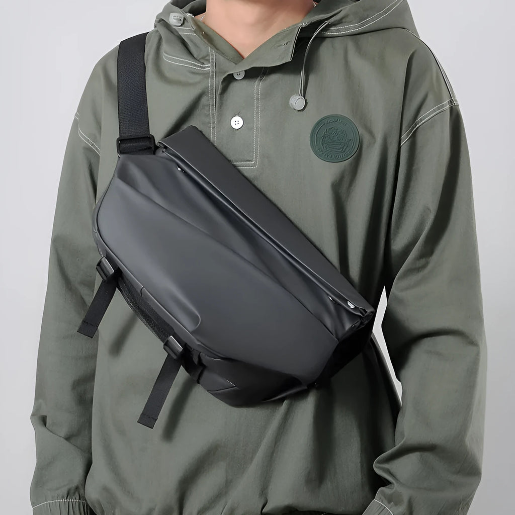 Men's grey medium crossbody sling bag showing internal phone and document compartments