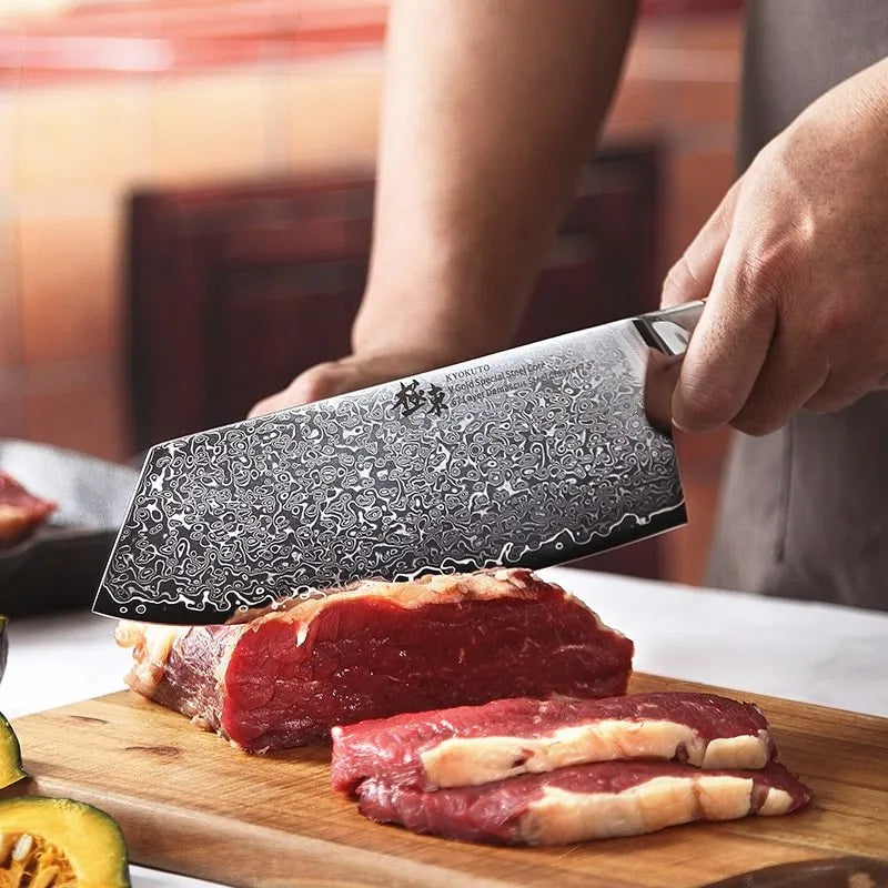 Damascus kitchen knife set with multiple blade sizes and V gold steel core on a kitchen counter.