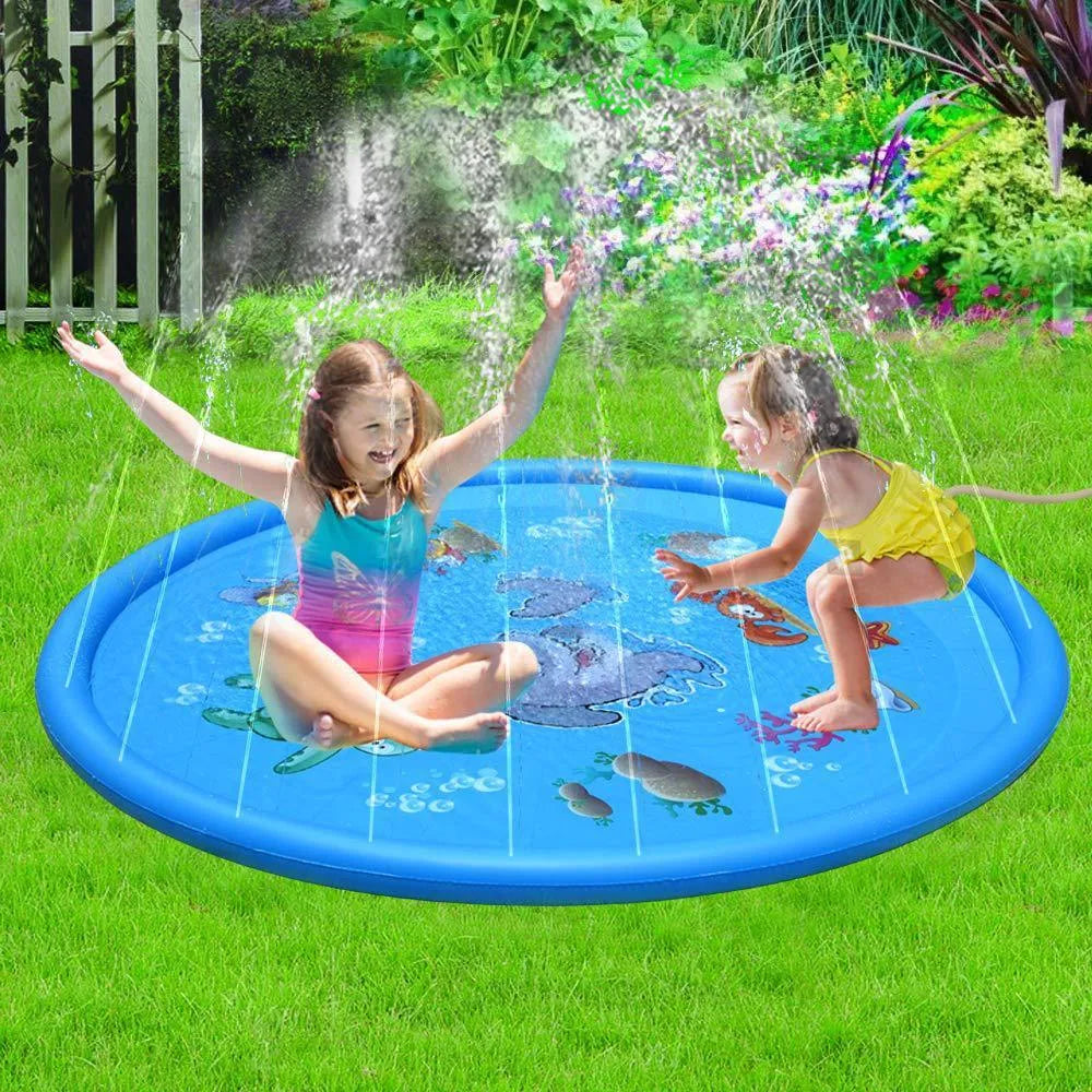 Blue PVC children's water spray play mat with marine animal print, shown on grass.