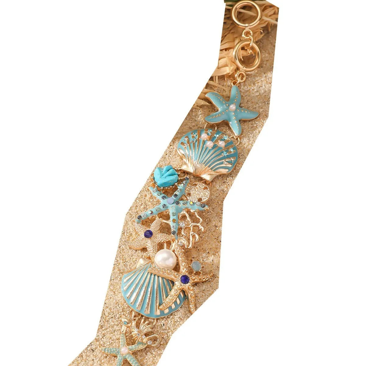 Women's alloy bracelet with a rhinestone-studded boat anchor and starfish charm in blue, red, or turquoise.
