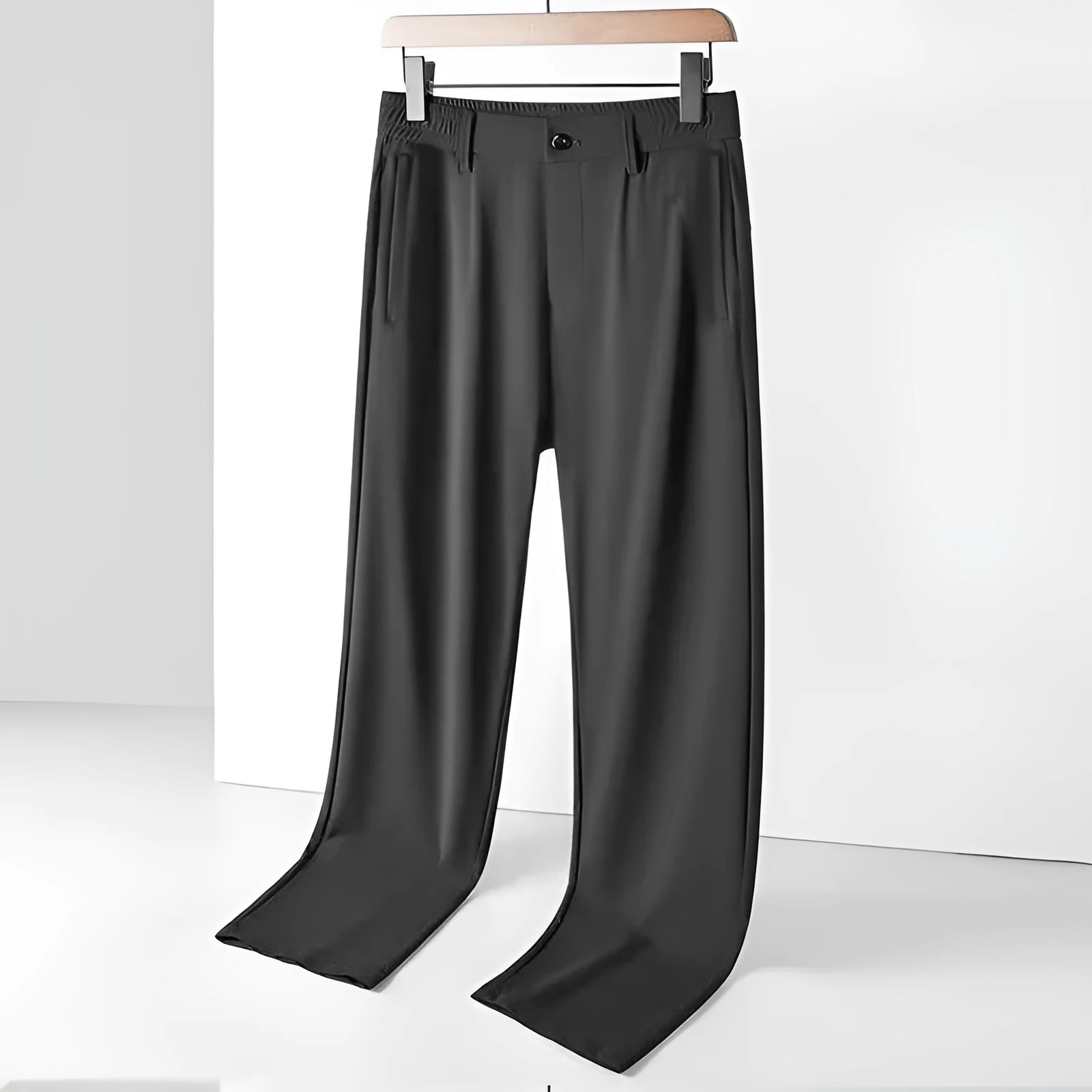 Men's black ice silk leisure trousers with elastic waist and straight leg design laid flat