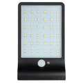 Outdoor solar garden light with LED illumination and waterproof IP65 rating in black or white finish