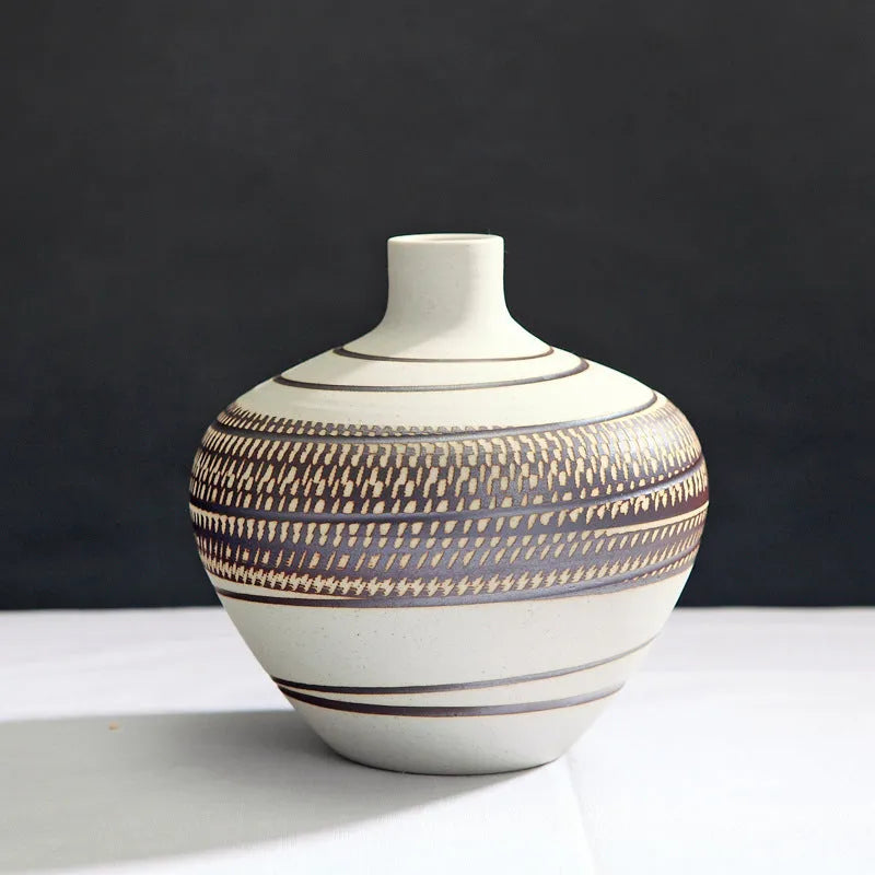 Three-piece ceramic vase set in low, medium, and tall sizes with vintage finish on a tabletop