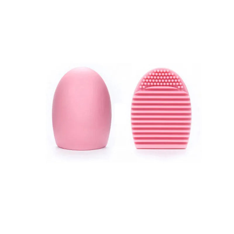Silicone makeup brush wash egg in blue with top knobs and bottom grooves for cleaning bristles