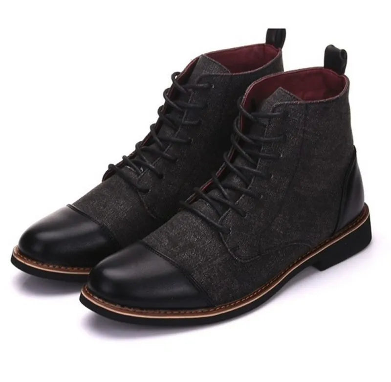 Men's black leather motorcycle boots with a silver buckle detail on a rubber sole.