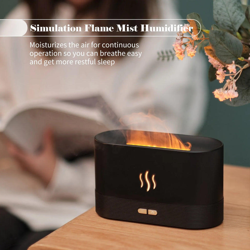 Square 180ml ultrasonic aroma diffuser with flame LED light in black, on a desk with visible mist