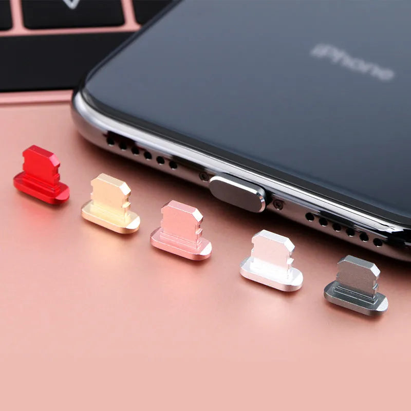 Aluminium alloy charging port dust plug for iPhone in various colours including gold, silver, and rose gold.