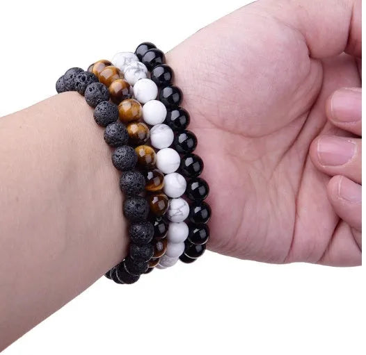 Geometric black agate bead bracelet for women with 8mm stones on a stretch elastic cord.