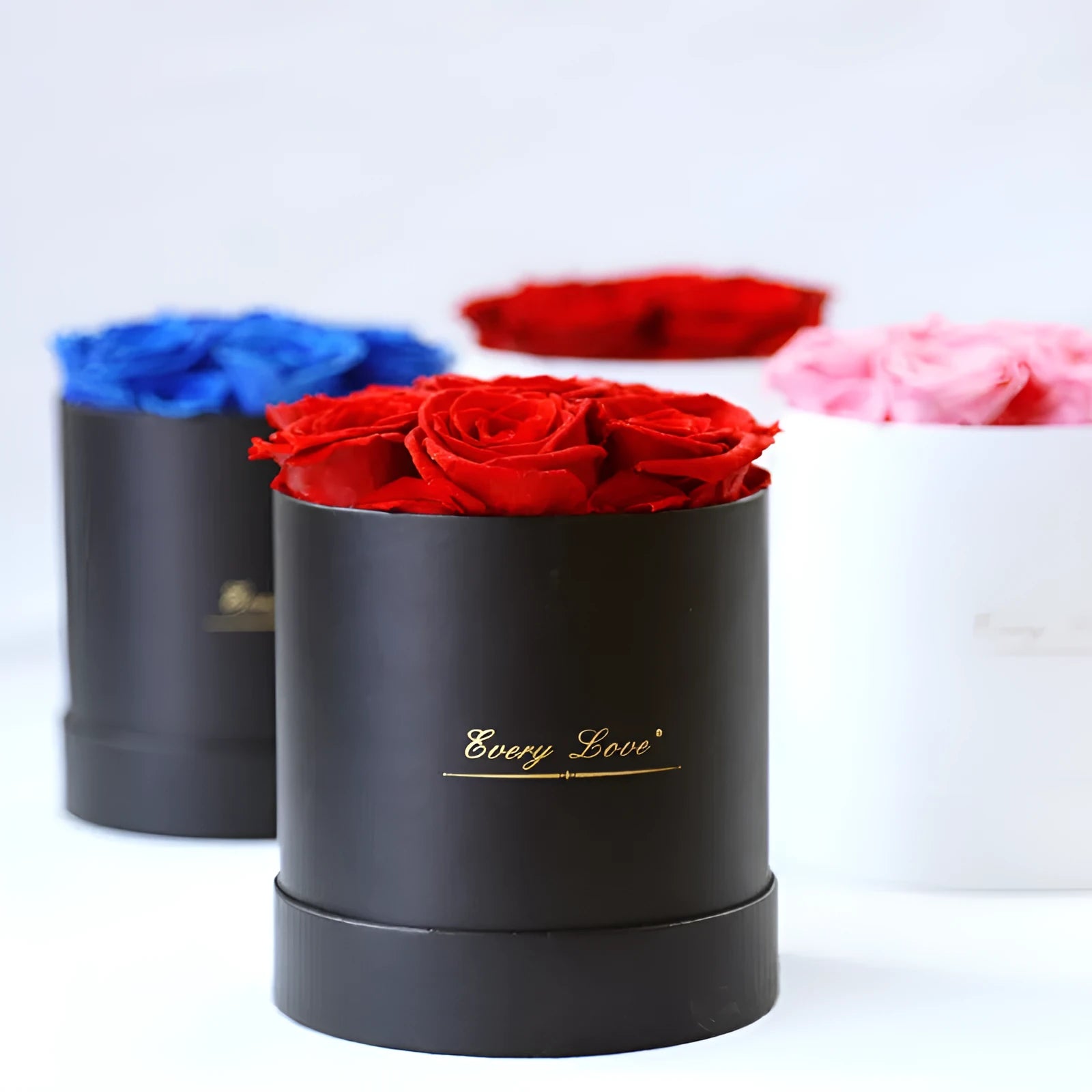 Handmade everlasting rose in hug bucket with preserved flower material, available in white red pink black blue colours
