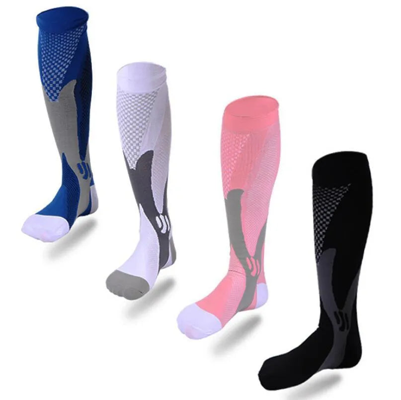 Graduated compression socks for men and women in black, shown laid flat.